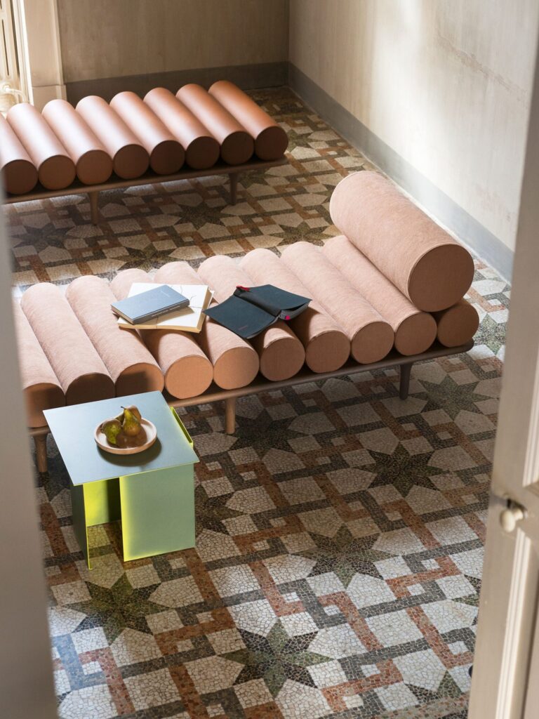 Two Five to Nine daybeds turn this terrazzo-floored seating area into an artistically accented sculptural eye-catching area.